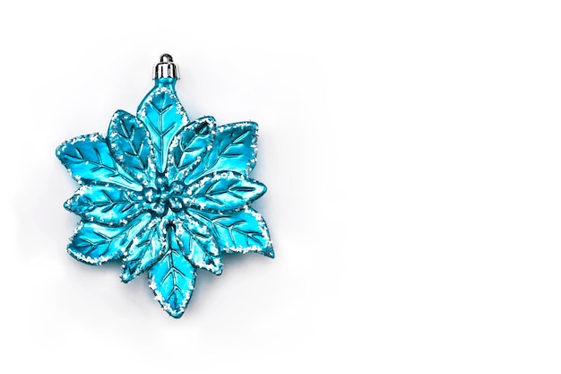 blue or cyan blown glass bauble to decorate the christmas tree, white background, space for text