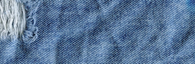 Blue denim jean texture background Jeans torn fabric texture
