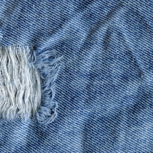 Blue denim jean texture background Jeans torn fabric texture