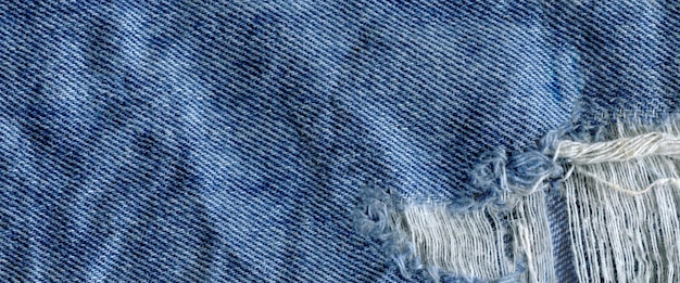 Blue denim jean texture background Jeans torn fabric texture