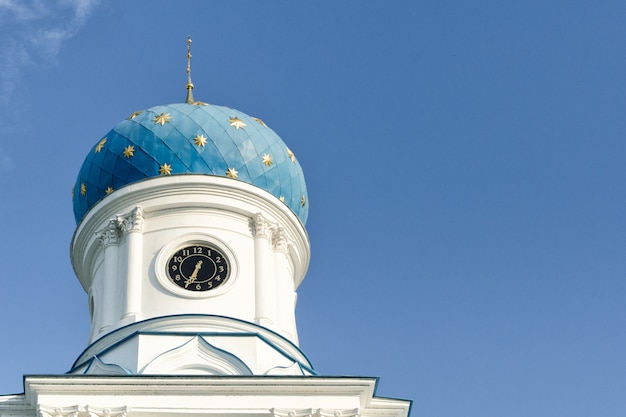 Blue dome of an orthodox temple against a blue sky. Bottom view