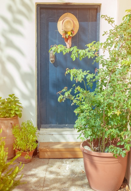 Blue door and a hat hanging