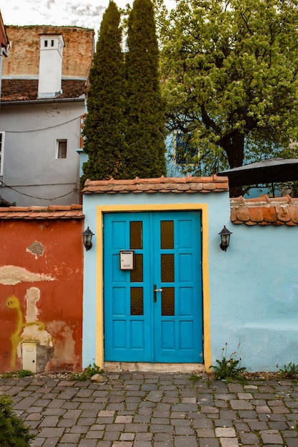 A blue door with a sign that says'the word " on it.