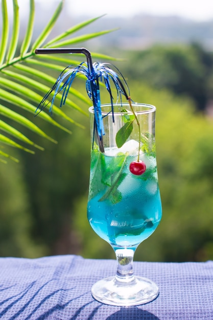 Blue drink with mint and cherry ice. 