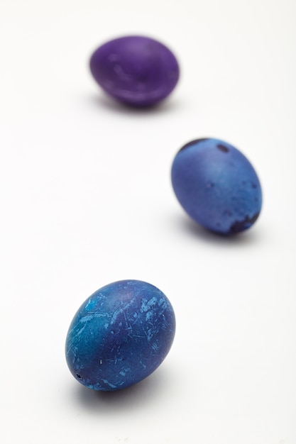 Blue Easter eggs on white background