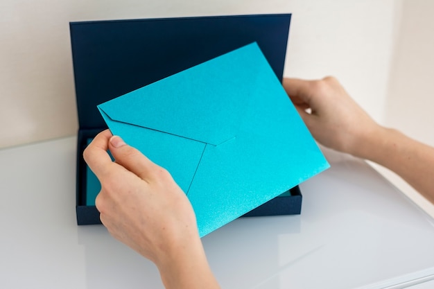 Blue envelope in a blue cardboard box