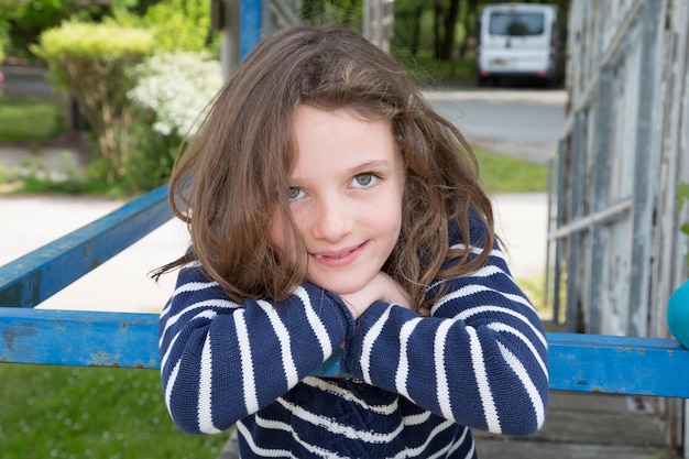 Blue eyes child girl outdoors garden home