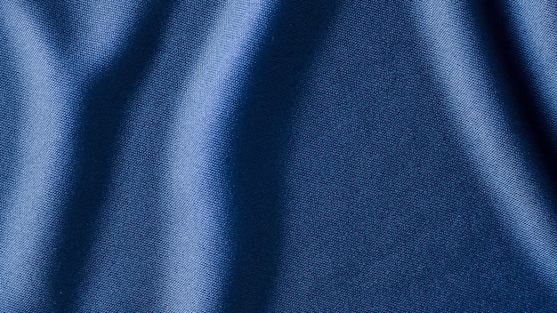 青い布の布の背景のテクスチャ