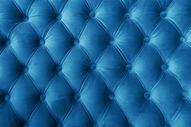 Photo blue fabric sofa texture with buttons