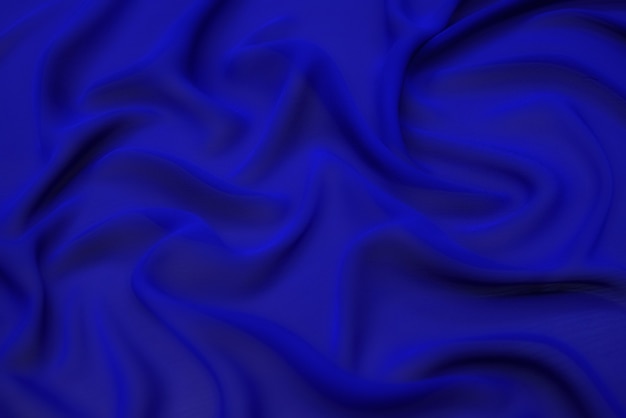 Blue fabric texture background, wavy fabric soft blue color, luxury satin or silk cloth texture.