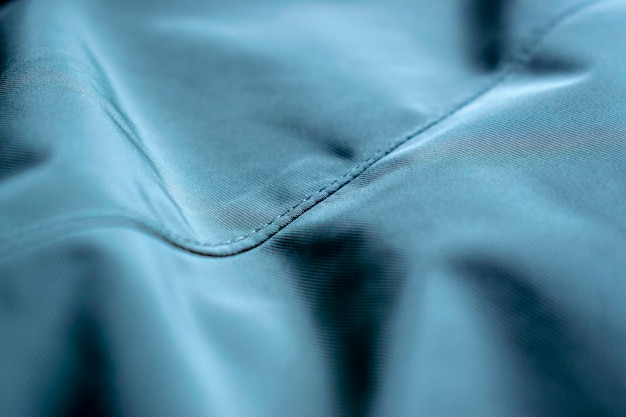 Blue fabric texture background with wave pattern