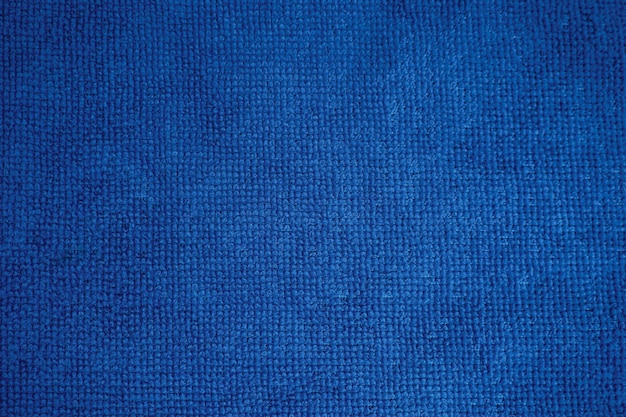 青い布のテクスチャのクローズアップ、壁紙の背景。
