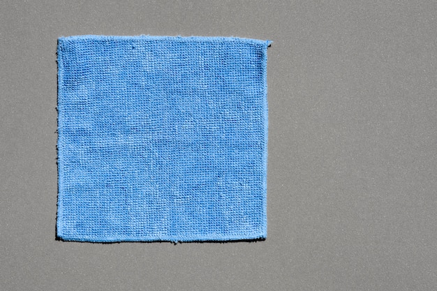 Blue fabric texture on grey background
