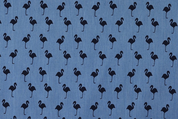 Blue fabric with black flamingo pattern prepared for sale in textile store high quality