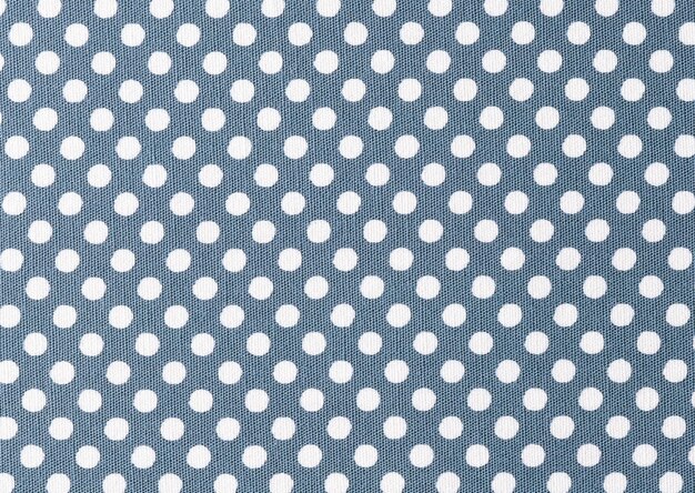 Foto il tessuto blu con i puntini bianchi proviene dalla collezione di puntini