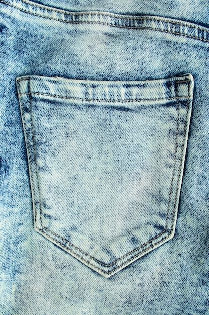 Фото Синий карман джинсов с выцветшим эффектом крупным планом в качестве фона