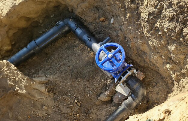 Blue faucet to control sewerage system in ground