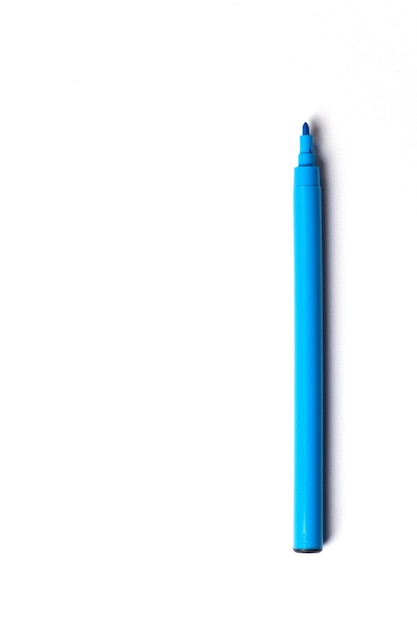 A blue felttip pen with a cap lies on a white background empty space for writing