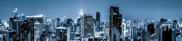 Blue-filtered cityscape and high-rise buildings in metropolis city center