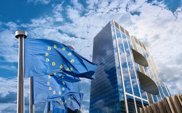 Blue flag of the European Union with bitcoin icons and a modern building in the form of a symbol of