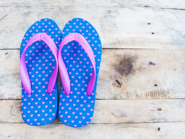 Blue flip flop with pink heart pattern