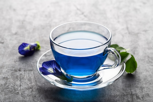 Blue flower tea of Butterfly pea on grey