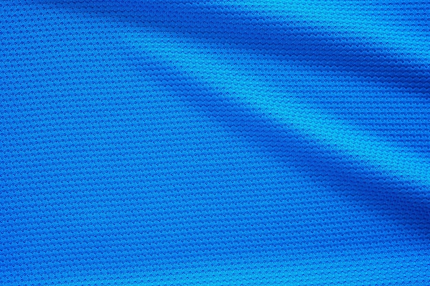 파란색 축구 저지 의류 직물 질감 스포츠 착용 배경은 위쪽 보기를 닫습니다.