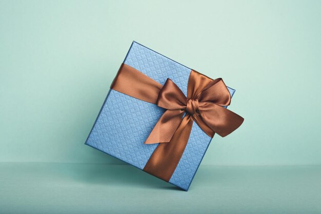 A blue gift on the blue background