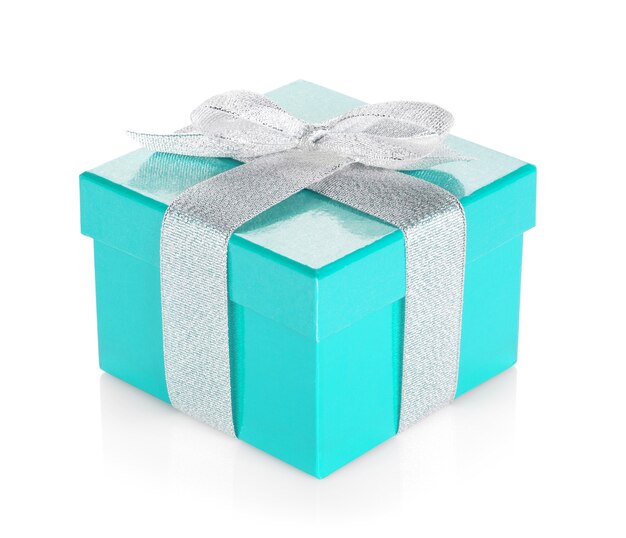 Blue gift box with silver ribbon and bow. Isolated on white background