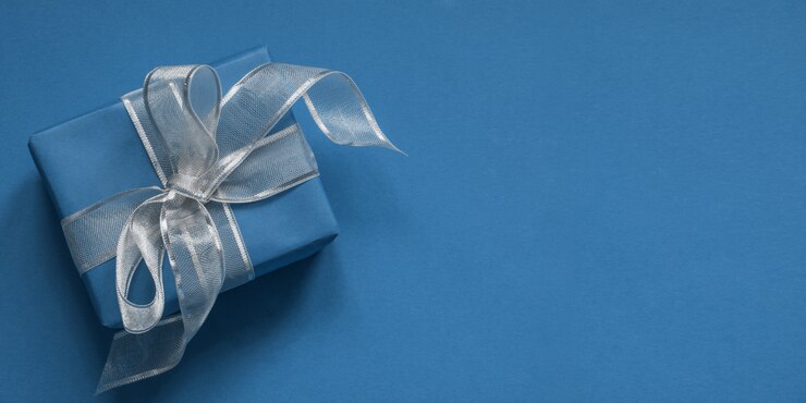 Blue gift box with silver ribbon