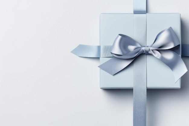 Foto nastro da regalo blu con un arco su uno sfondo grigio generativo ai