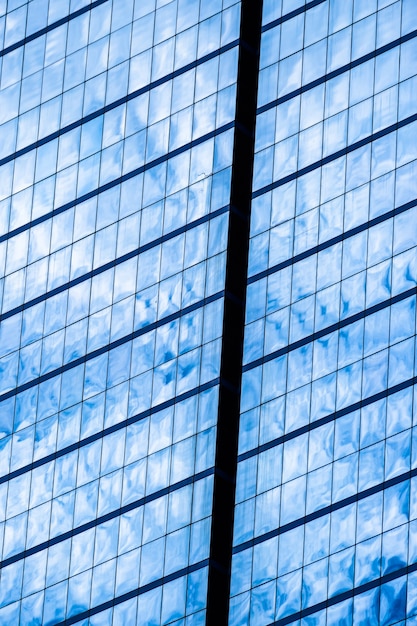 Blue glass windows of office building for background