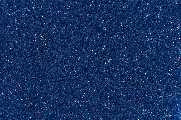 Blue glitter for texture or background. High resolution photo.