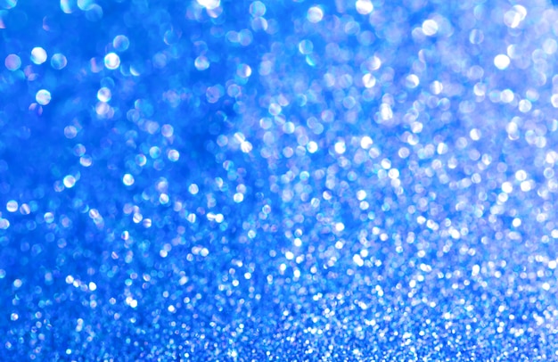 Blue glitter texture christmas abstract background. Shiny wrapping paper texture, greeting card design element.