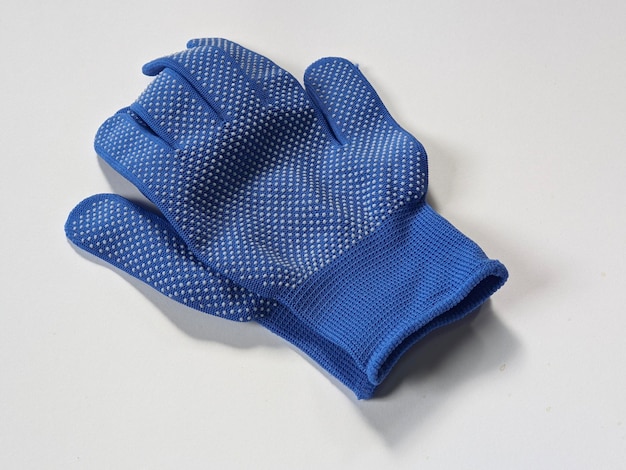 A blue glove on isolated background