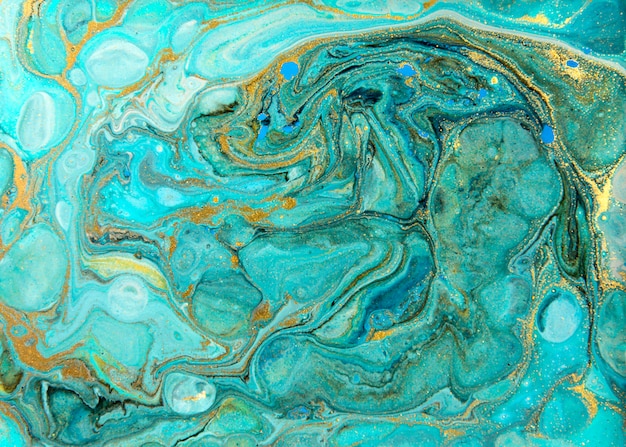 Photo blue and gold marbling pattern. golden marble liquid texture.