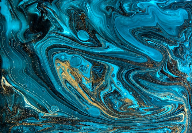 Foto modello di marmorizzazione blu e oro. trama liquida marmo dorato.