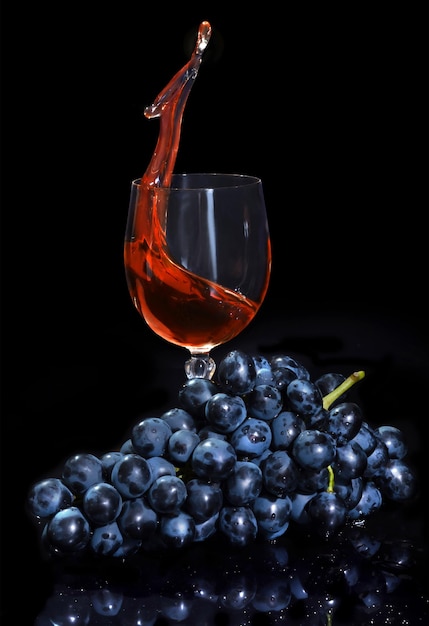 Blue grapes and grape juice in a grocery on a black background