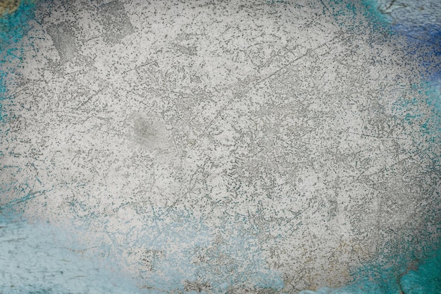 A blue and gray textured background with a blue and white pattern.