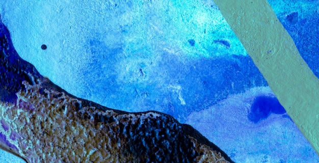 A blue and green abstract painting of a rock with the word love on it.