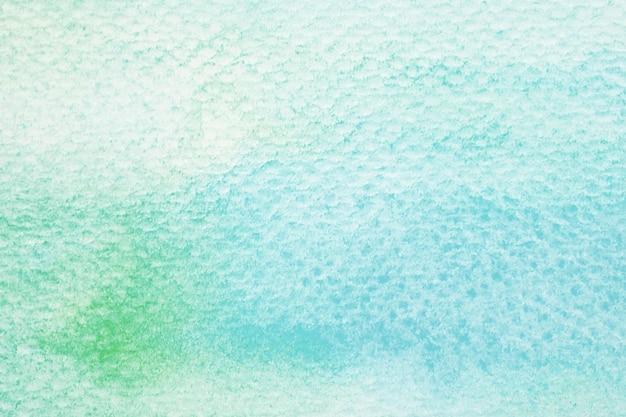 Blue and green abstract watercolor painting textured on white paper background