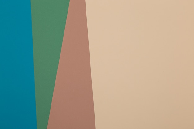 Blue, green, brown and yellow background, colored paper geometrically divides into zones