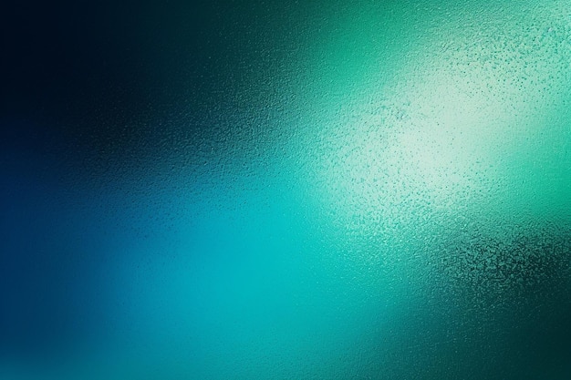 a blue and green colored background with a water droplet