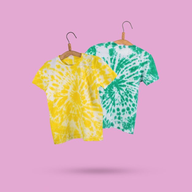 Blue and green tie dye Tshirts on a pink background