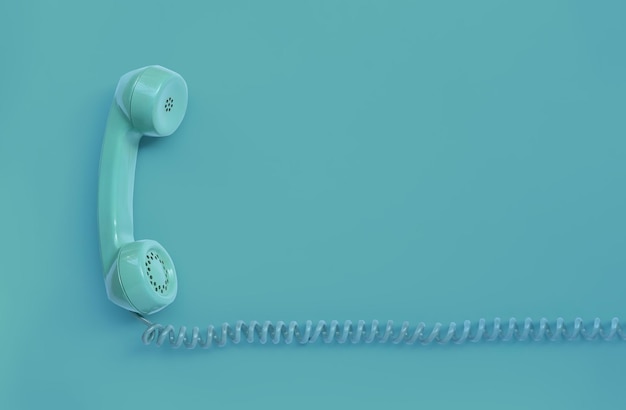 A blue-green vintage dial telephone handset with blue background.