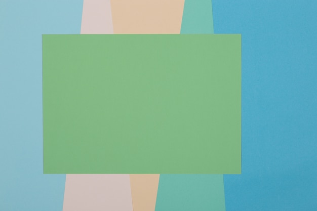 Blue, green, yellow background, colored paper geometrically divides into zones