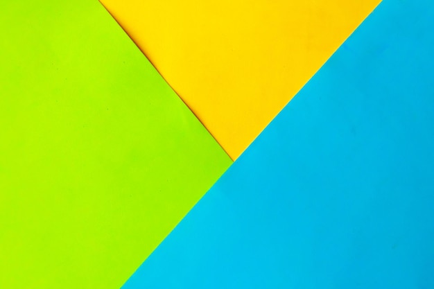 Blue green and yellow geometric abstract paper background