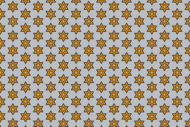 Photo a blue and grey quilt with a pattern of yellow stars.