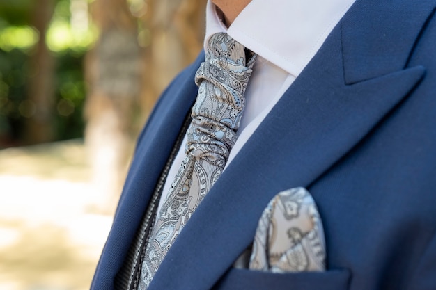 Blue groom suit with gray vintage tie and matching scarf