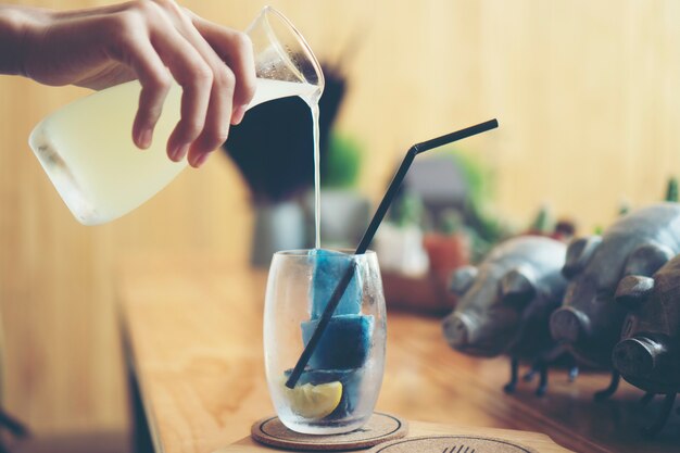 blue herb and lemon water with ice